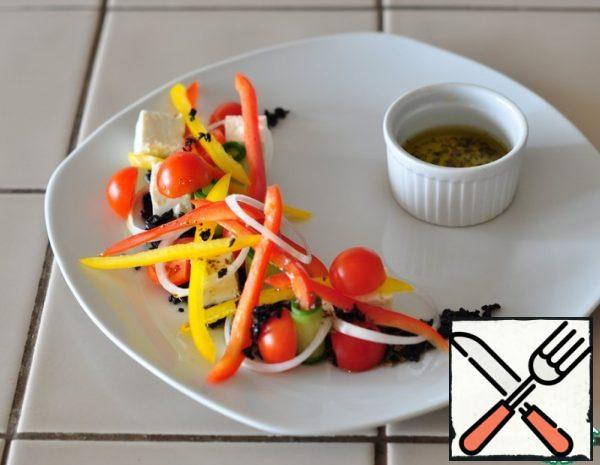 First you need to prepare a salad dressing-mix olive oil, salt, pepper and oregano. Cut the cheese into cubes, cut the cucumber into thin plates, red onion into thin rings, bulgarian pepper into strips, cherry tomatoes cut in half. Dried olives must be crushed so that they look like "earth". 