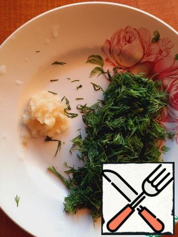 Mix the sauce: chop the herbs, pass the garlic through a press or a fine grater.