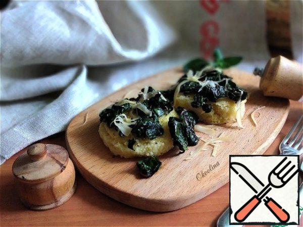 Serve immediately, putting hot polenta on a plate and fried chard on top. Sprinkle With Parmesan.