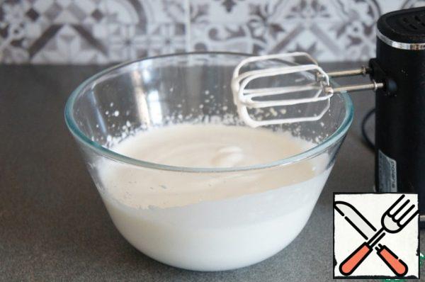 Beat the eggs with sugar until a thick white foam. Beat for about 5-7 minutes.