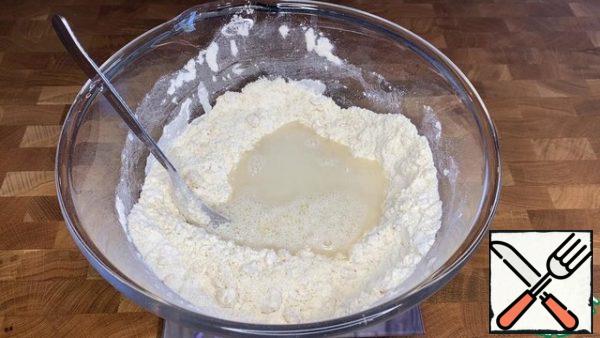 Add salt and water. Knead the steep dough.