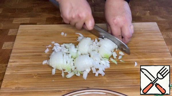 Chop the onion and fry in butter.