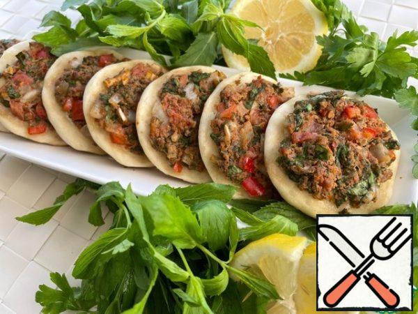Served hot with lemon and parsley. Lemon and parsley extinguish the fat content and muffle the taste of onion and garlic in the filling.