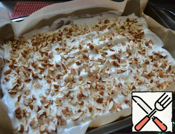Chop the almonds with a knife. Scatter over the meringue.