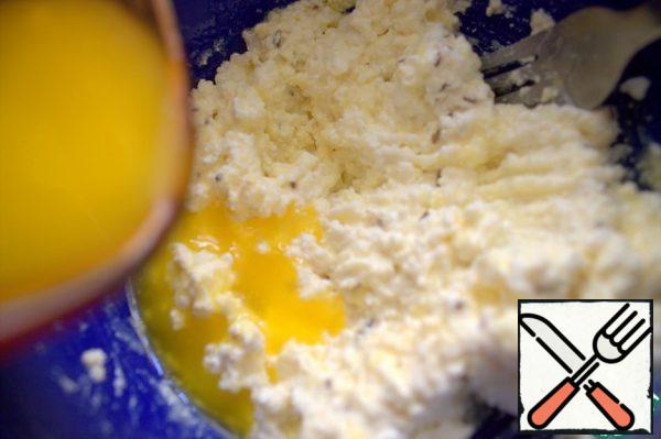 Add soft or melted butter. Mix it up. If the cottage cheese is too wet, mix it with a spoonful of flour.
