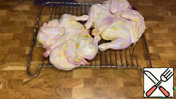 Bake the chickens in the oven on the grill, collecting the released oil and pouring it over the chickens.