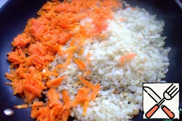 Chop the onion and carrot. Lightly fry together.