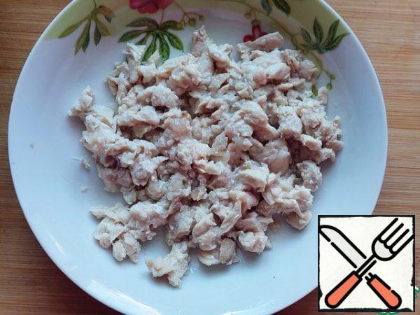 For the third filling, boil the chicken fillet and finely chop it.