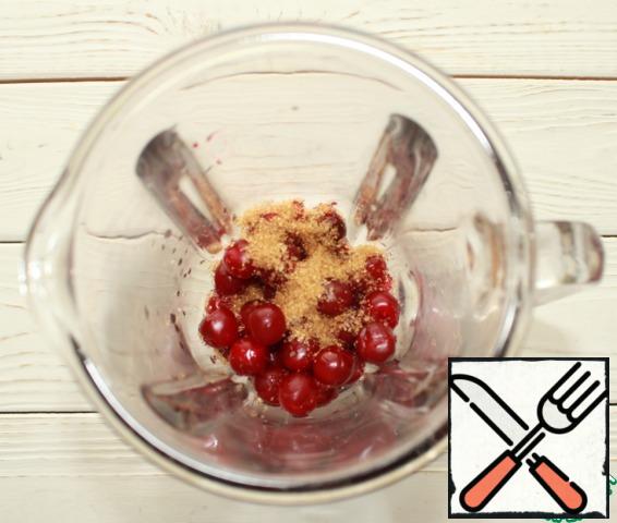 Wash the cherries well in running water, remove the seeds, place the berries together with the sugar in the bowl of a blender (you can also take frozen cherries, but in this case it must be thawed beforehand).
