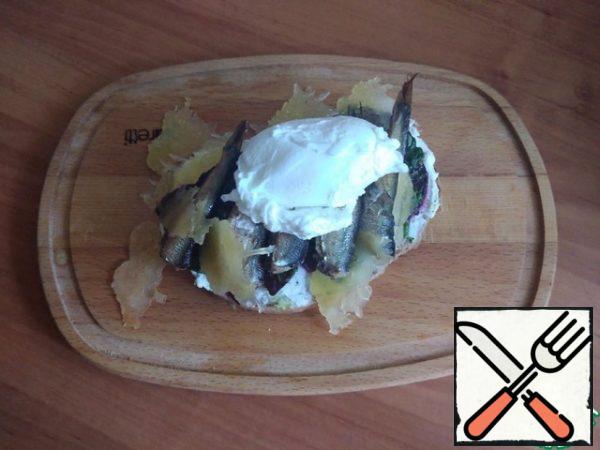 We put a poached egg on the sprats.