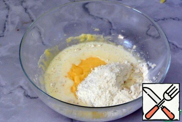 Pour in half of the dry mixture and pour in half of the milk.