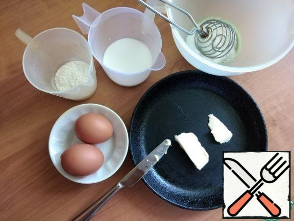 We prepare all the ingredients. I have an old cast-iron frying pan D-18 cm. We heat the oven to t-220-230 C. I set the time to 20 minutes. 5 minutes to preheat the oven and 15 minutes to bake a pancake.