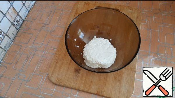 We put the cottage cheese in a cup.