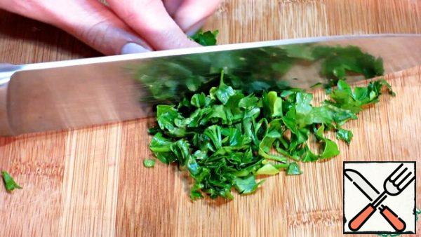 We chop the greens not very finely.