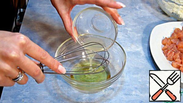 We make the dressing by mixing a spoonful of lemon juice with two tablespoons of oil with a whisk or fork.