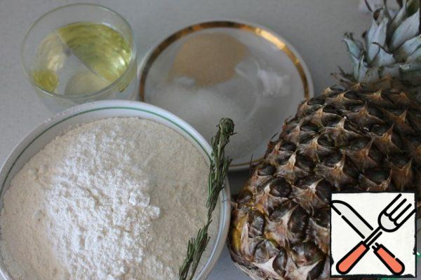 We will prepare all the ingredients. The flour should be sifted, the pineapple should be washed.