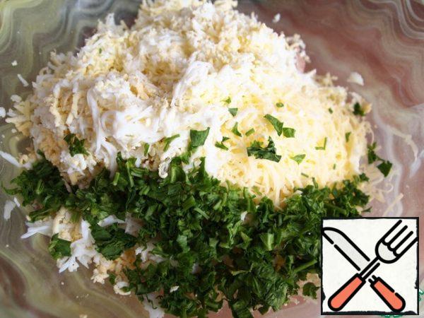 Then add the pre-boiled eggs, grated on a fine grater, and finely chopped herbs.