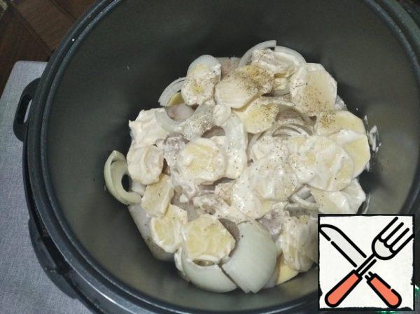 Lay in layers - Potatoes (without mayonnaise), half an onion, pour water, lay pieces of hake, the second half of the onion and cover everything with potatoes that were mixed with mayonnaise - "Stewing" mode for 60 minutes.