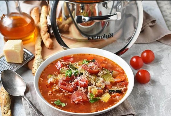 Serve the soup hot, with grissini or focaccia, if desired, sprinkled with grated parmesan and garnished with fresh parsley.