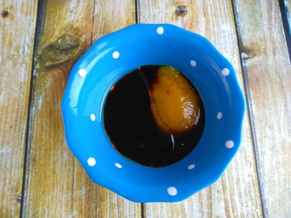 Prepare the marinade by mixing honey, olive oil, and soy sauce. Coat the goose inside and out with the marinade, leaving it for 15 minutes. Repeat the process, wrap the goose in plastic, and refrigerate for 12 hours or overnight.


