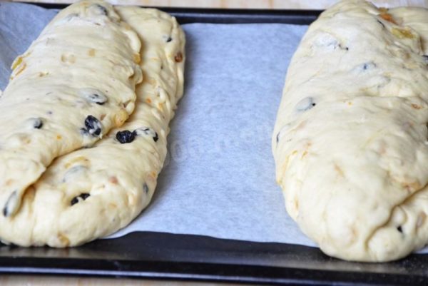 Transfer the stollen shapes to a parchment-lined baking sheet and let them proof for about 20 minutes. Bake the stollens in a preheated 175°C oven for approximately 40 minutes.


