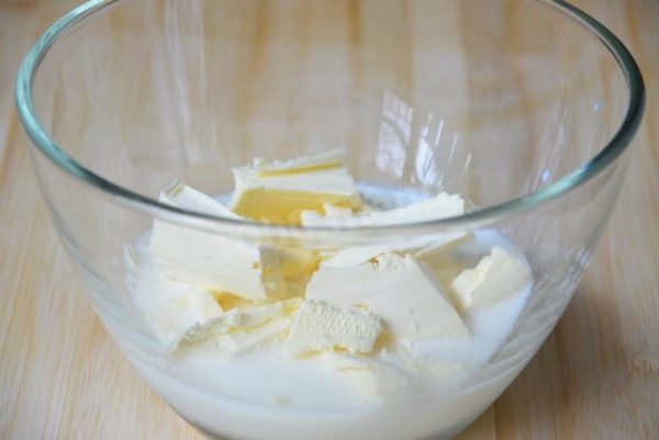 Combine butter with milk. Gradually heat the milk to melt the butter. This can be done on the stovetop in a saucepan or in the microwave.


