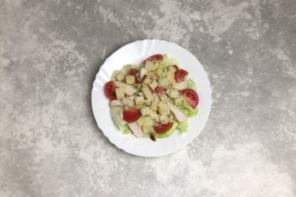 Place the croutons on top and generously sprinkle with grated parmesan cheese.

