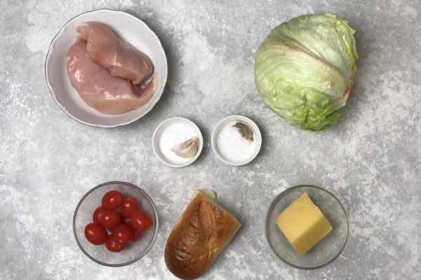 Begin by preparing the ingredients for crafting the classic Caesar salad with chicken.
