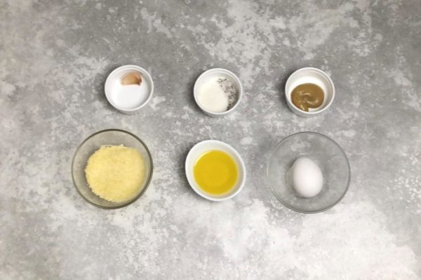Assemble the ingredients for the sauce, keeping in mind that the sauce's flavor hinges on the quality of the selected components. Opt for a mustard with a milder heat to avoid overshadowing the other flavors. Ensure the cheese and butter are of high quality, and use a fresh egg.

