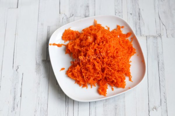 Grate the carrots using a medium grater as well. While a larger grater can be used, smaller ingredients result in a more delicate salad.


