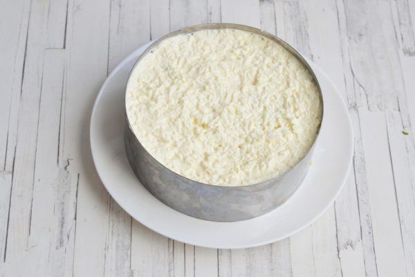 Add the grated egg whites as the final layer. Brush this layer with mayonnaise and smooth it well as it is the last layer.


