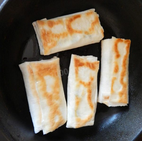 Remove the pita bread envelopes from the pan and serve hot. Enjoy your meal!
