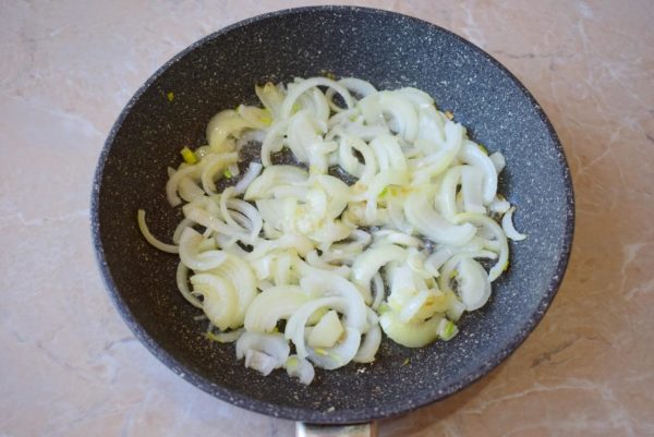Heat the frying pan until hot and add a small amount of vegetable oil. Place the chopped onion in the pan and fry for a minute until it becomes transparent.


