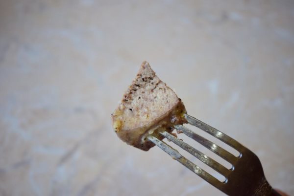 Liver cooks relatively quickly. Break the largest piece - the break should be uniformly gray without a pink tinge. For reassurance, warm up the liver for an additional minute. Overcooking the liver can make it tough and rubbery.



