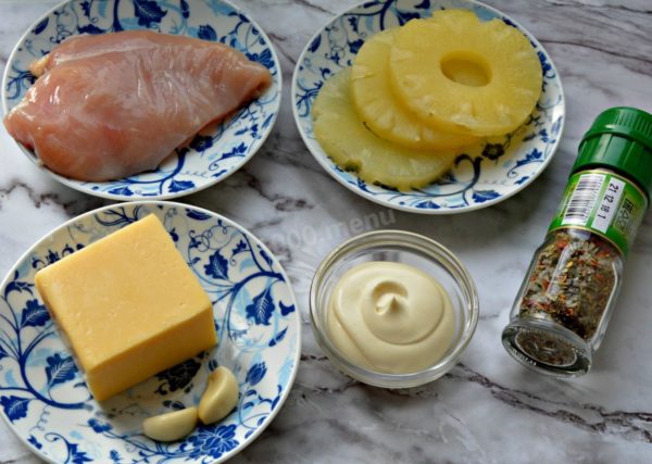 Begin by preparing all the necessary ingredients for the salad with pineapple, chicken, cheese, garlic, and mayonnaise. If you're expecting a large number of guests, consider doubling or even tripling the quantities. Adjust the amount of garlic to suit your taste.

