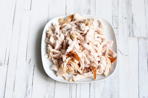 Disassemble the smoked chicken into fibers using your hands, discarding the skin. Half a smoked breast works well for this recipe.


