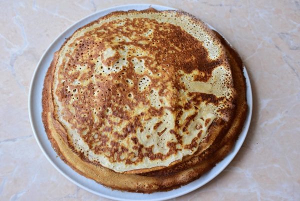 Stack the completed pancakes on a separate plate and keep them covered to prevent drying out.


