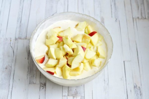 Add the prepared apple pieces to the dough and gently fold everything together with a spatula.

