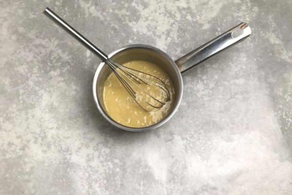 Whisk the eggs with sugar and flour until well combined.

