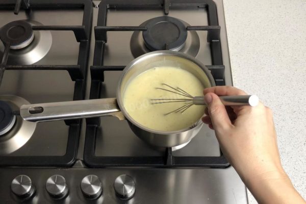 Cook the custard while stirring continuously until it comes to a boil. It will thicken significantly and form large bubbles. As soon as it boils, remove it from the heat immediately.

