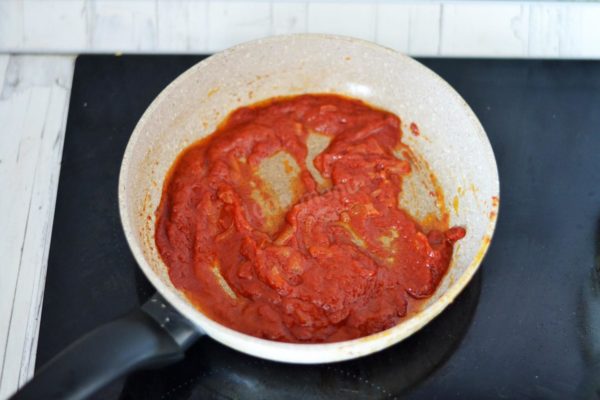 Add the tomato paste, stir, and cook for an additional minute.


