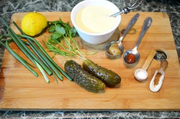 How to prepare a homemade classic tartar sauce with pickles and mayonnaise? Gather all the necessary ingredients. The foundation of this sauce is mayonnaise, and it's best to use high-quality mayonnaise. Homemade mayonnaise is ideal, but you can also use store-bought mayonnaise. While using a high-quality mayonnaise is key, you can replace it with sour cream if desired, but it will alter the sauce's flavor. You can use either salted cucumbers for a classic taste or pickled cucumbers for a spicier version.


