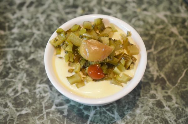 Add the diced cucumbers, mustard, and Worcestershire sauce to the mayonnaise. Spicy Russian mustard is recommended for the best flavor.

