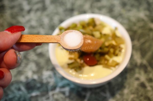Season the sauce with a pinch of salt according to your taste. Keep in mind that mayonnaise and cucumbers already contain salt, so you may not need to add any additional salt.

