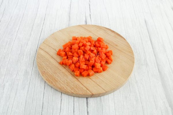 Peel the carrots and cut them into cubes as well.

