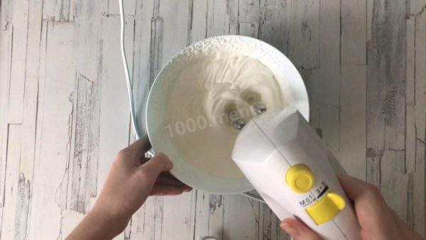 Separately, use a mixer or blender to whip the cream until it forms stiff peaks.



