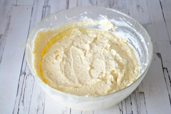 Allow the dough to rest for 15-30 minutes, allowing the semolina to swell. Why use semolina instead of flour? Baking with semolina results in a more tender and fluffy texture. The casserole will hold its shape and remain intact after baking. Preheat your oven to 180°C (350°F) at least 10-20 minutes before baking. Transfer the dough to an appropriately sized baking dish; mine measured 25 by 28 cm (approximately 10 by 11 inches).

