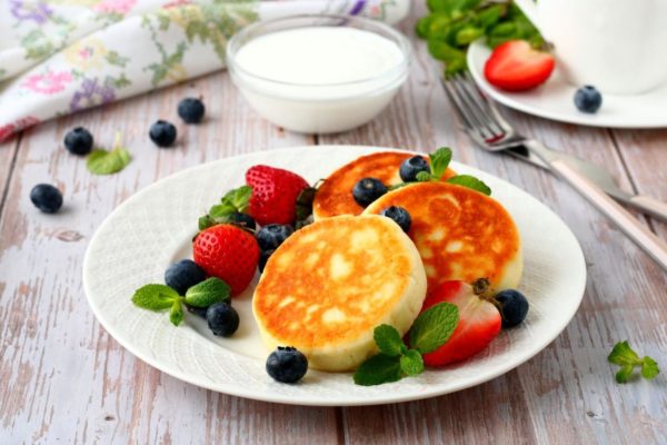 Cottage Cheese Cheesecakes with Flour in a Frying Ppan