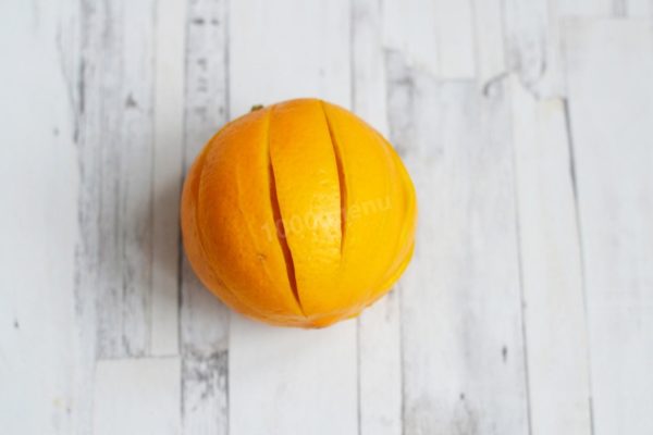 Rinse the lemon thoroughly and dry it. Use a knife to make deep cuts all over the lemon to help release its juice during the chicken's baking process.

