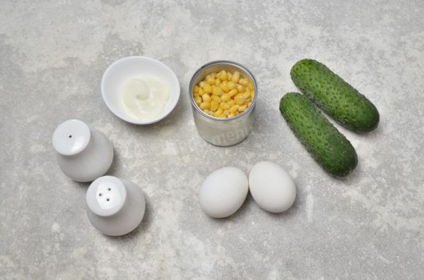 How to prepare a salad with cucumbers, eggs, mayonnaise, and corn? Gather the necessary ingredients. Begin by boiling the eggs and allowing them to cool. If you have small cucumbers, use one per serving. If using a large cucumber, one should suffice.

